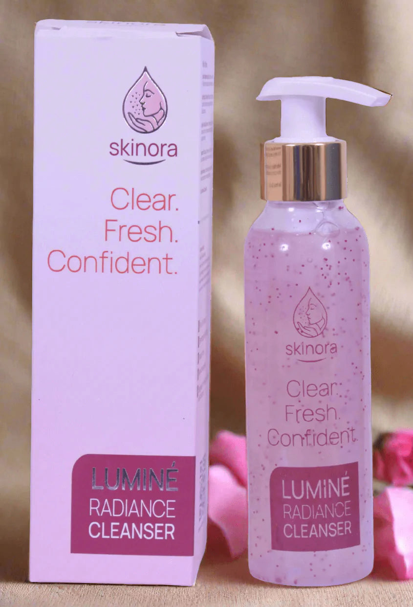 Skinora Lumine Radiance Cleanser bottle and packaging on a blurred background