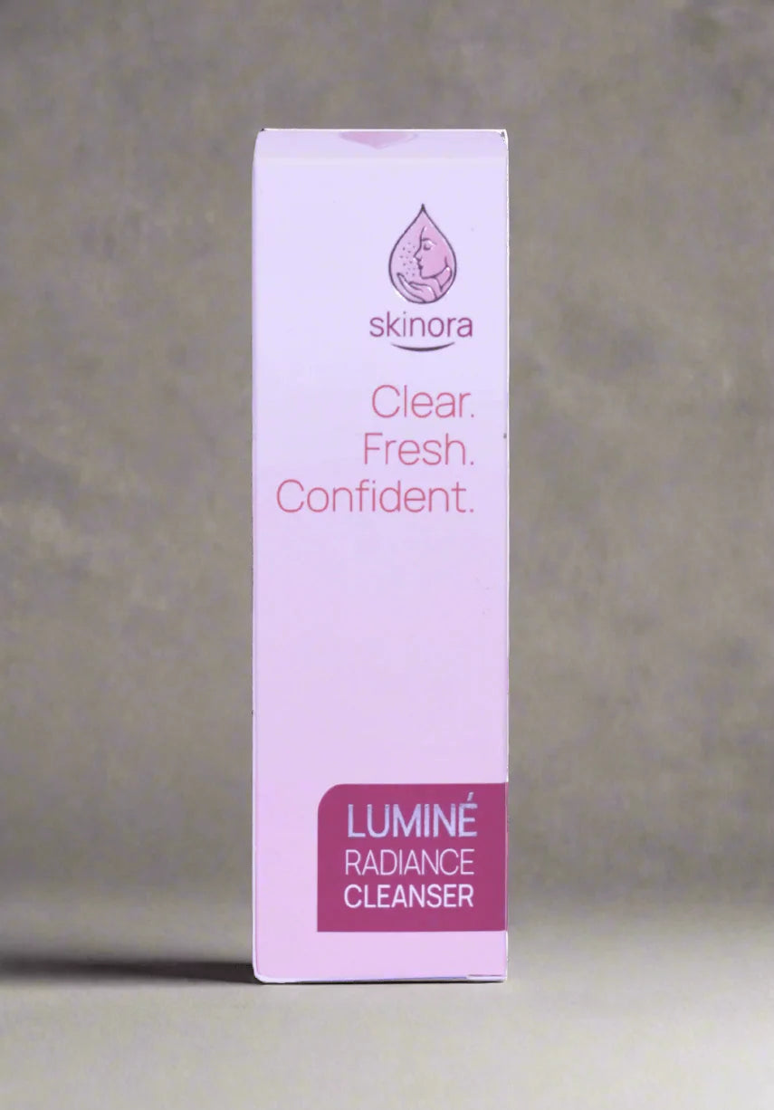 Skinora Luminé Radiance Cleanser packaging on a gray background