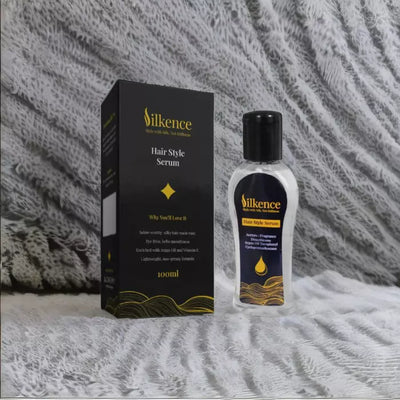 Silkence hair style serum bottle and packaging on a textured surface